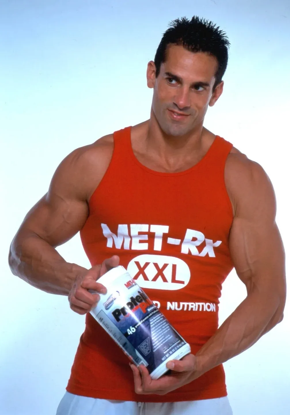 A man holding a bottle of water in his hand.
